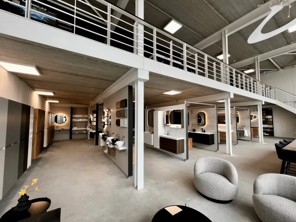 a room with a loft and a large white wall